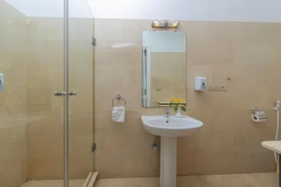 a bathroom with a shower and a sink at Stunning villa with private heatable pool in Hurghada