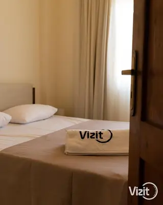 a sign on a bed that says vittoria on it at Cosy flat in Makadi heights in Hurghada