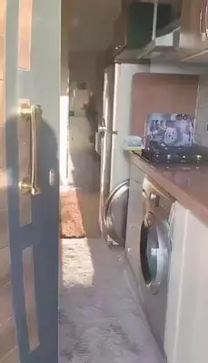 an open door to a kitchen with a stove at شالية بقرية الذهبية in Hurghada