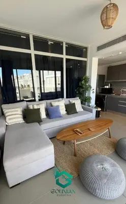 a living room with a couch and a coffee table at Sholan, 1 Bedroom, Ground floor in Hurghada