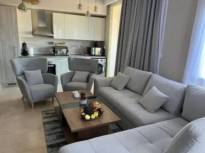 a living room with a couch and a table at SunShine Mangroovy-M10 in Hurghada