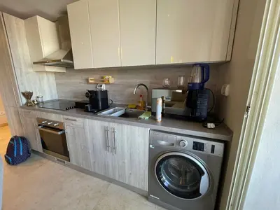 a kitchen with a washing machine and a sink at SunShine Mangroovy-M10 in Hurghada