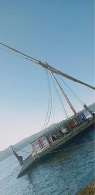 a large boat in the water with at Nile Bride Felucca in Aswan