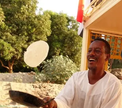 a man holding a frisbee in his hand at Nile Bride Felucca in Aswan