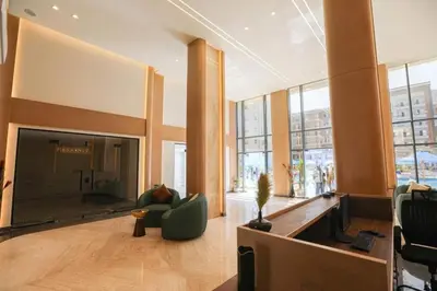 a living room with a large fireplace in a building at Tiba Golden Resort in Hurghada
