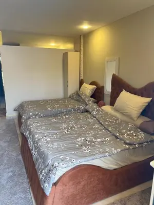 a large bed in a room with at Tiba Golden Resort in Hurghada