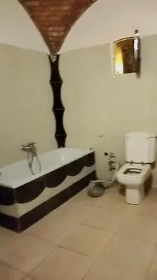 a bathroom with a bath tub and a toilet at Nuba in Aswan