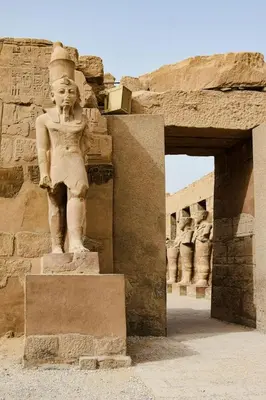 a statue of a woman standing on top of a building at 4 Days Nile Cruise from Luxor to Aswan in Luxor