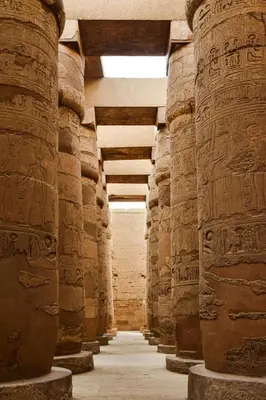 an empty hallway in an ancient building with columns at 4 Days Nile Cruise from Luxor to Aswan in Luxor