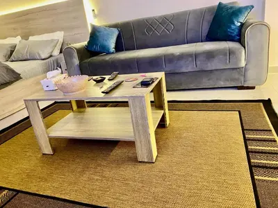a living room with a coffee table and a couch at Juliana Beach in Hurghada