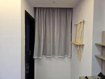 a room with a window with a curtain at قرية الهمبرا السياحية بالغردقة in Hurghada