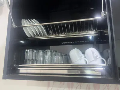 a refrigerator filled with dishes and glasses at Dream apartment3 in Hurghada