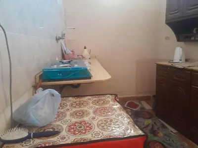 a small bathroom with a sink and a table at Sunset Mirage in Luxor