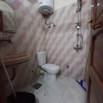 a bathroom with a toilet and a bath tub at Remal City in Luxor