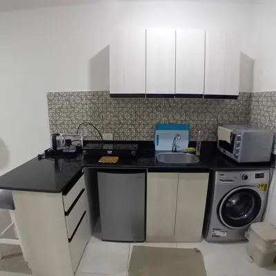 a kitchen with a sink and a microwave at Tiba Golden -unit102 - Aladauy in Hurghada