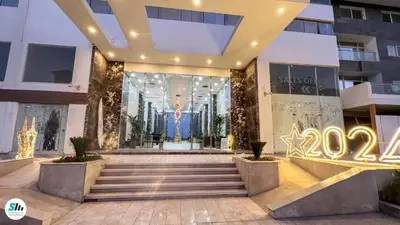 a building with a sign in front of it at Scandic Hurghada 323 in Hurghada