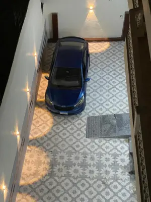 a car parked in the middle of a garage at Al-Fardous house in Luxor