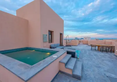 a swimming pool on the roof of a house at Ancient Hill 3BR Gouna Sea View & Priv Roof Pool in El Gouna