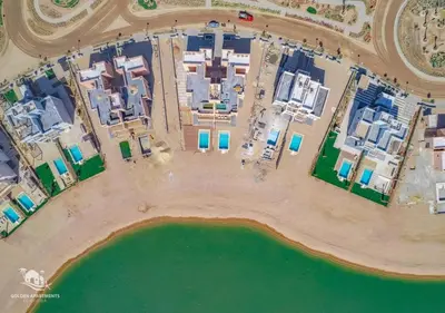 an aerial view of a resort complex next to a body of water at Ancient Hill 3BR Gouna Sea View & Priv Roof Pool in El Gouna