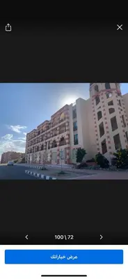 a television screen with a picture of a building at Marsa Alam Port Ghalib in Marsa Alam