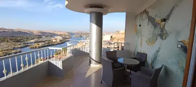 a balcony with a view of a river at Aswan Nile View Dreams in Aswan