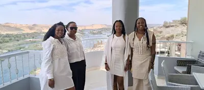 a group of women standing on a balcony at Aswan Nile View Dreams in Aswan