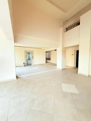 an empty room with white walls and tile floors at شقه فندقية متكامله 1 غرفه غايه فى الروعه والهدوء hurghada in Hurghada