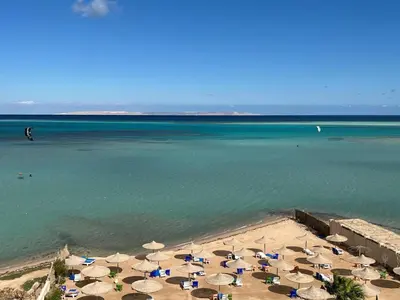 an aerial view of a beach with umbrellas and the ocean at Villa Shams El Bahr in Hurghada