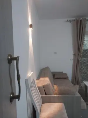 a set of stairs in a room with a chair at Royal residence in Marsa Alam