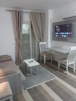 a living room with a couch and a table at Royal residence in Marsa Alam