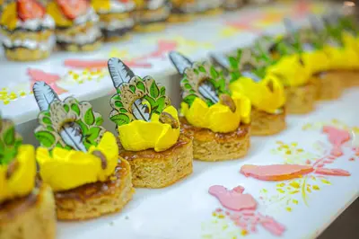 a group of cupcakes with flowers on a table at Marlin Inn Azur Resort in Hurghada