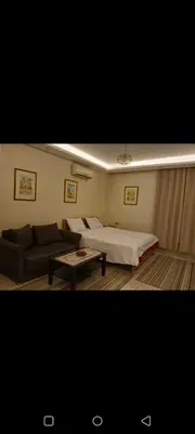 a living room with a bed and a couch at Enter compound in Hurghada