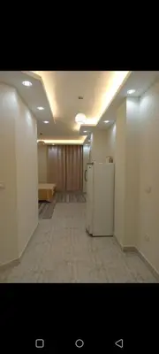 an empty hallway with a refrigerator in a room at Enter compound in Hurghada