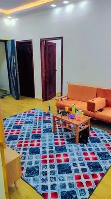a living room with a couch and a table at Eslam Apartments in Hurghada