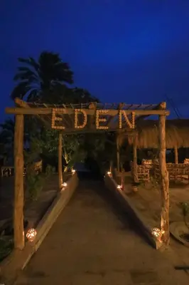 a wooden arch with a sign that reads end at Eden on the Nile in Luxor
