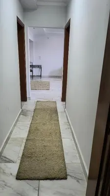 an empty hallway with a rug on the floor at Paradise Hill in Hurghada
