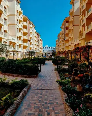 a brick walkway in front of some apartment buildings at Luxury Sea view studio in Hurghada