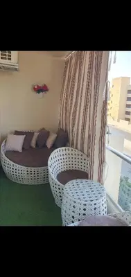 a room with a bed and a couch and chairs at Luxury Sea view studio in Hurghada