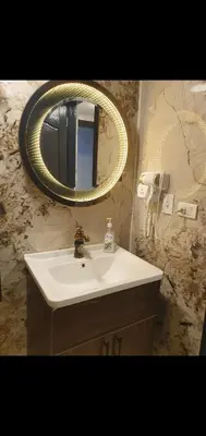 a bathroom with a sink and a mirror at Luxury Sea view studio in Hurghada