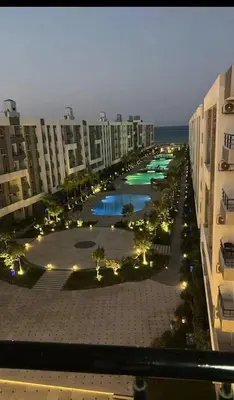 an aerial view of a city with buildings and a pool at Fanadir bay in Hurghada