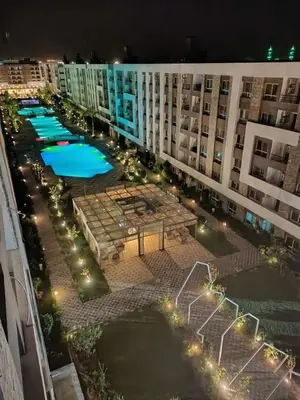 an aerial view of a large apartment complex at night at Fanadir bay in Hurghada