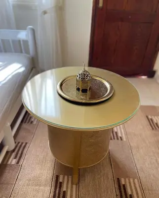 a glass table with a plate on top of it at Serene Apartment Makadi Heights in Hurghada