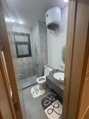 a bathroom with a toilet and a sink at luxury apartment Makadi heights phase 2 in Hurghada