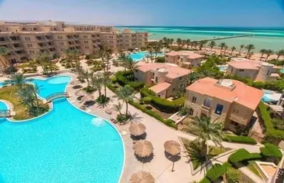 an aerial view of a resort with a swimming pool at Home always in Hurghada