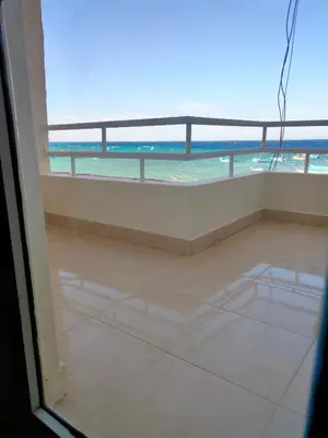 a view of the ocean from the balcony of a condo at Aquarium Seaview accomodations in Hurghada
