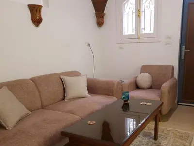 a living room with a couch and a coffee table at House Mountain in ‘Ezbet Abu Ḥabashi