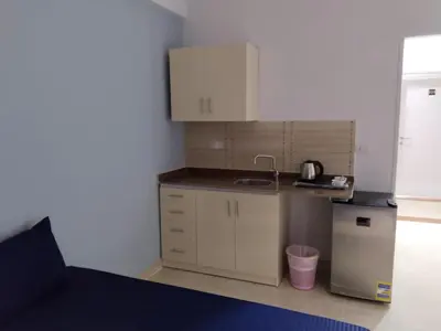 a small kitchen with a counter and a sink at Aquarium Seaview accomodations in Hurghada