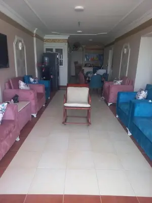 a living room with pink and blue furniture at شقة فندقية على البحر منطقة القيادات 2 in Hurghada