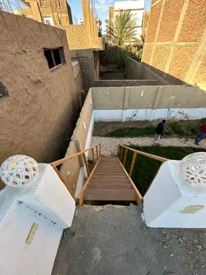 a staircase leading up to a building with a stair case at Tuya House Luxor in Luxor