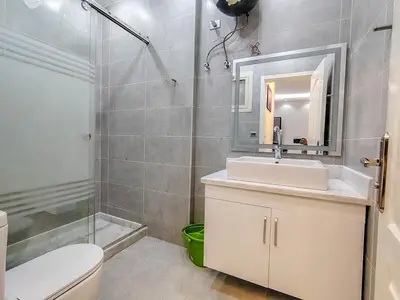 a bathroom with a sink and a shower and a toilet at Sea view one bedroom apartment in Hurghada Dreams in Hurghada